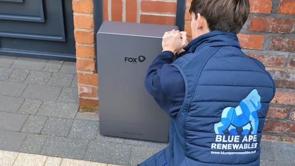 Blue Ape Renewables engineer installing a home solar battery